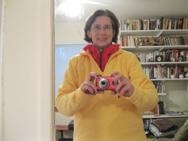 Amy in a garish yellow fleece over a bright red windbreaker.