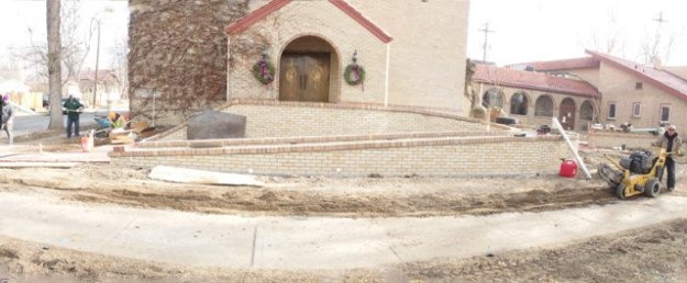{Image: a panoramic view in which the entire ramp is visible close up, with construction equipment to the right.}