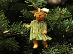 Image:  ornament consisting of Golden Retreiver in baggy green gown.