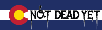 Image:  Not Dead Yet logo superimposed on the Colorado state flag.